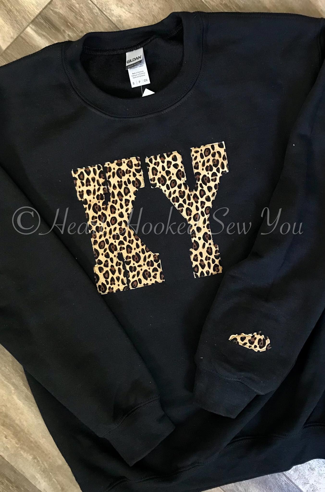 State Abbreviation With State Outline On Sleeve